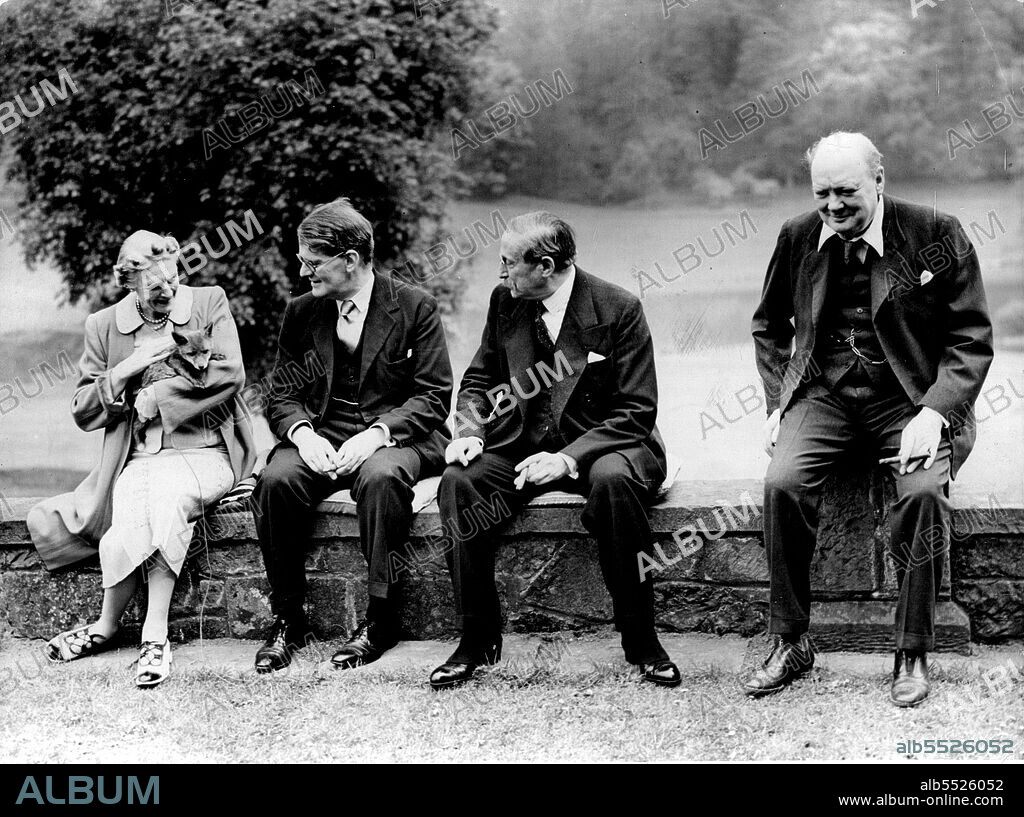 M. Leon Blum Visits Mr. Churchill At Kent Home - Left to Right - Mrs. Churchill (with a fox cub bred on the estate); Mr. Richard Law (son of the former Premier, Bonar Law); M. Blum and Mr. Winston Churchill at Westerham, Kent.M. Leon Blum, the French Socialist leader and former, who is visiting London to confer with prominent people on the question of conscription, visited Mr. Winston Churchill, the politician, at his country home at Westerham, Kent. May 10, 1939.