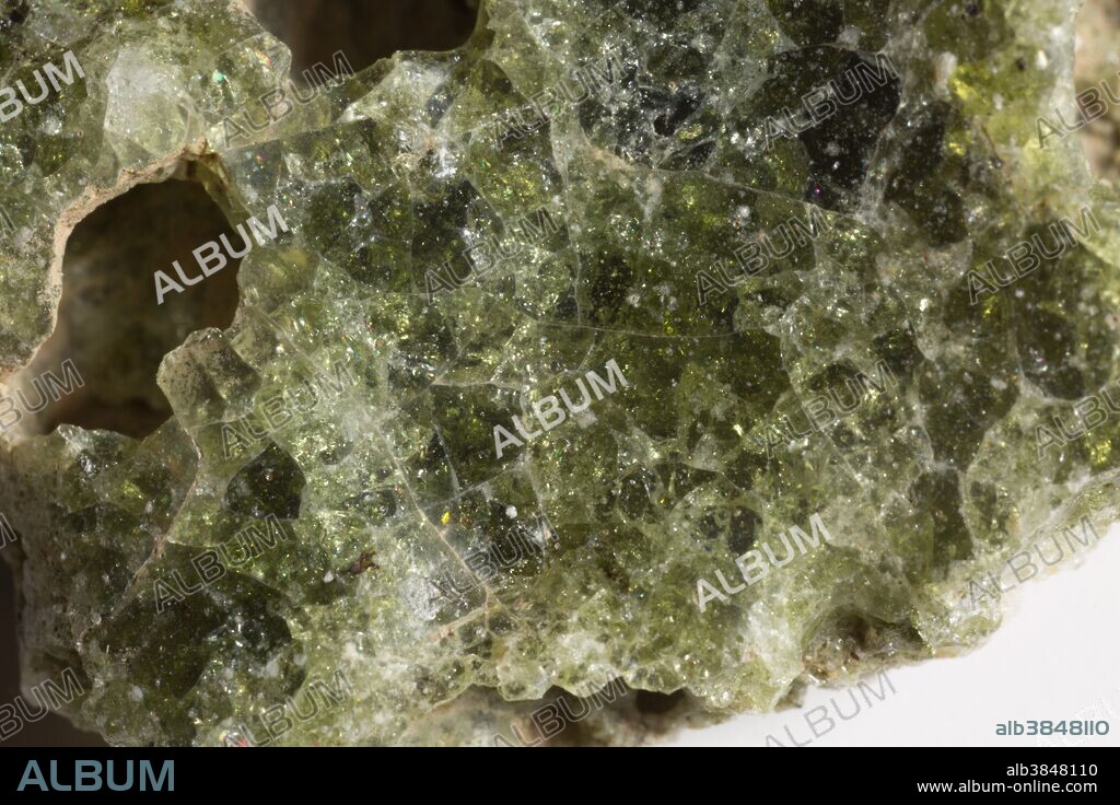 Trinitite, also known as atomsite or Alamogordo glass, is the glassy residue left on the desert floor after the plutonium-based Trinity nuclear bomb test on July 16, 1945, near Alamogordo, New Mexico. The glass is primarily composed of arkosic sand composed of quartz grains and feldspar that was melted by the atomic blast. Trinitite is mildly radioactive but is safe to handle for short periods of time.