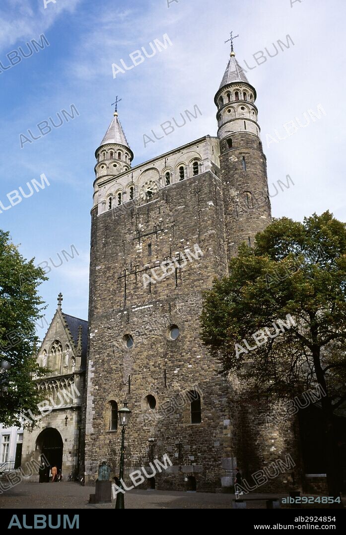 Netherlands. Maastricht. Basilica of Our Lady (Basiliek van Onze-Lieve-Vrouw). Romanesque style church. View of Entrace Merode Chapel and westwork. A 13th-century Gothic portal, rebuilt in the 15th century, provides access to the church as well as to the so-called Merode chapel (or Star of the Sea chapel). The westwork, built of carbonic sandstone, dates from the early 11th century and is flanked by two narrow towers with marlstone turrets.