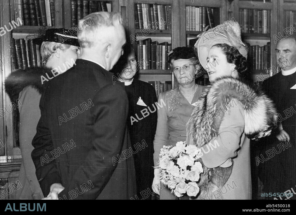 Queen Meets World's Missionaries -- Her Majesty the Queen talking to Australian and New Zealand Church Missionary Society representatives. Left to right - The Right Rev. The Bishop of Nelson, New Zealand, and his wife Mrs. Stephenson; The Rev. R. J. Hewett, Federal Secretary of the Society of Australia and Tasmania; and his wife, Mrs. Hewett; and Her Majesty The Queen.Her Majesty The Queen this evening visited the City of London Head Quarters of the Church Missionary Society in Salibury-Suare, Fleet, Street, when she met officials and staff of the society, and inspected the building from which contact is maintained with about 1,000 missionaries in various parts of the world. October 27, 1948. (Photo by Reuterphoto).