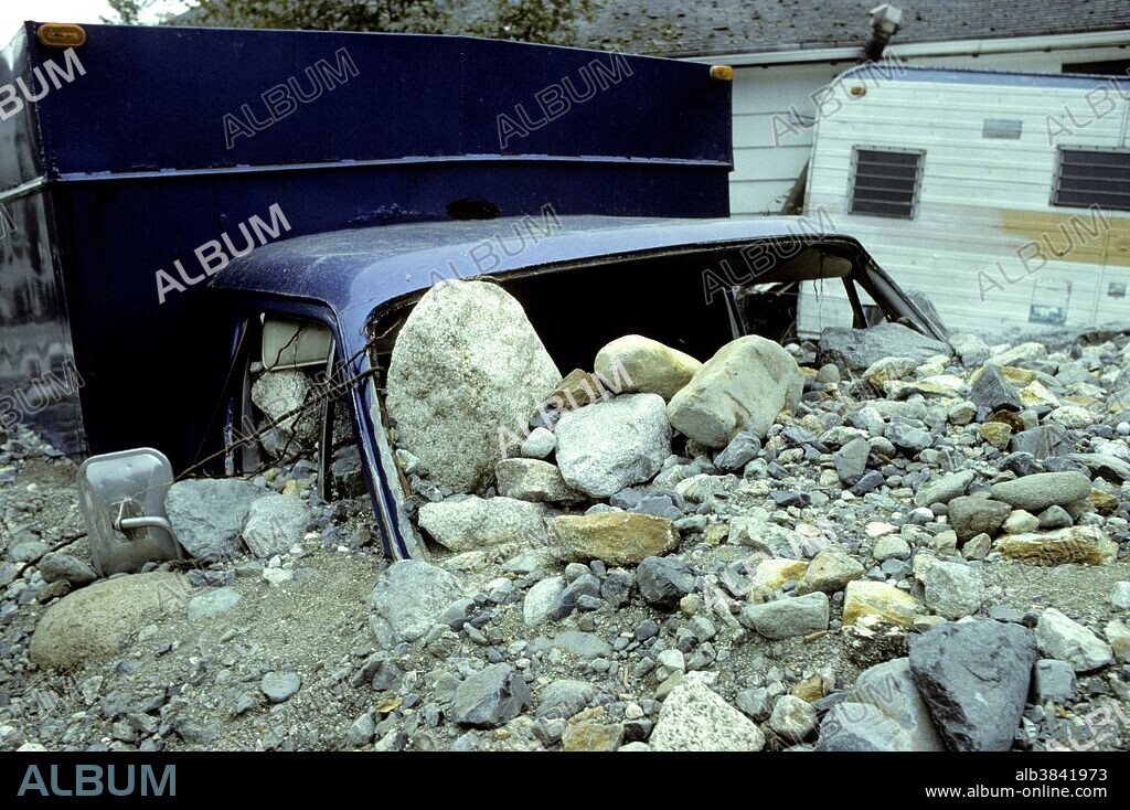 Property damage from debris torrent caused by a flood in 1991. Britannia Beach, near Vancouver, British Columbia, Canada.