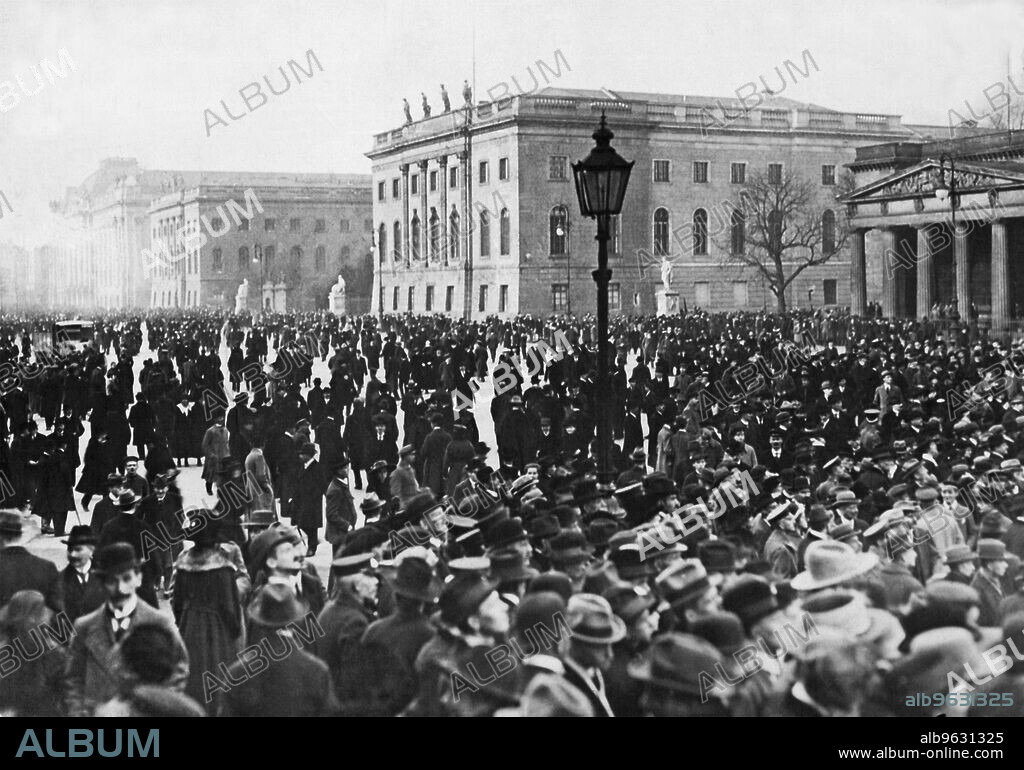 Berlin, Germany November 8, 1918 Crowds of soldiers and workmen gather upon Unter den Linden in front of the Reichstag building to hear Philipp Scheidemann proclaim that Germany is now a Republic and no longer a monarchy.