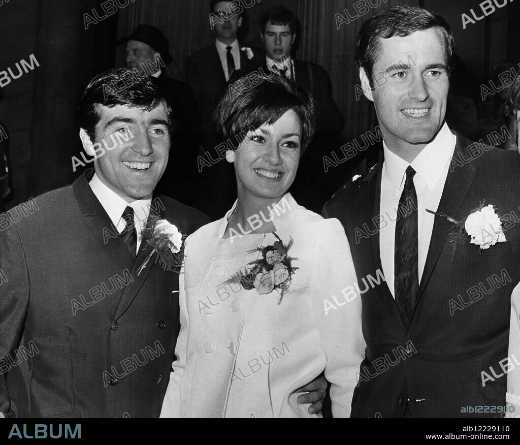 Wedding day smiles from George Graham , the 22 year old Arsenal centre-forward and his bride Marie Zia , also 22 . On the left is George's best man Terry Venables , his former club-mate at Chelsea who is now an inside forward with Tottenham Hotspur . Marylebone register office , London. 16 September 1967.