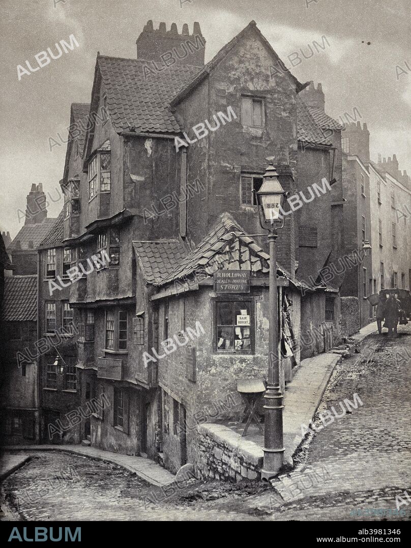 The junction of Steep Street and Trenchard Street, Bristol, 1866. This view was recorded five years before Steep Street, curving away to the left, was demolished and replaced by a realigned road, Colston Street. Steep Street existed in the medieval period when it was the main road from the centre of Bristol to Gloucester. This photograph was published in 1891 as a nostalgic view by Bristol art publishers and print sellers Frost & Reed. A limited run of 100 prints was produced and the negative destroyed. Platinum print.