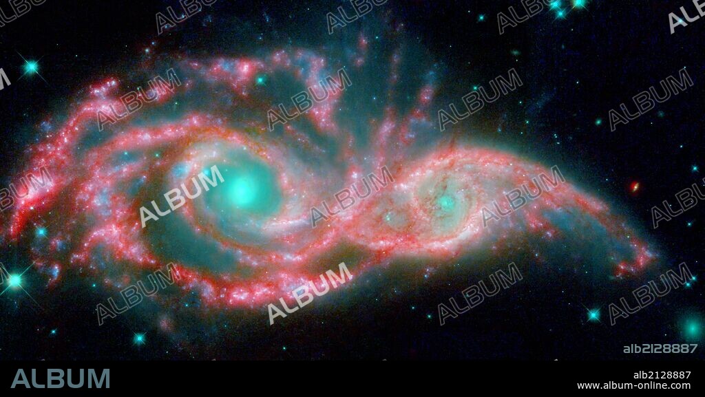 NGC 2207 and IC 2163 met and began a sort of gravitational tango about 40 million years ago. The two galaxies are tugging at each other, stimulating new stars to form. Eventually, this cosmic ball will come to an end, when the galaxies meld into one. The dancing duo is located 140 million light-years away in the Canis Major constellation. Hubble Space Telescope (HST),Spitzer Space Telescope.  (Photo by: Universal History Archive/UIG via Getty Images).