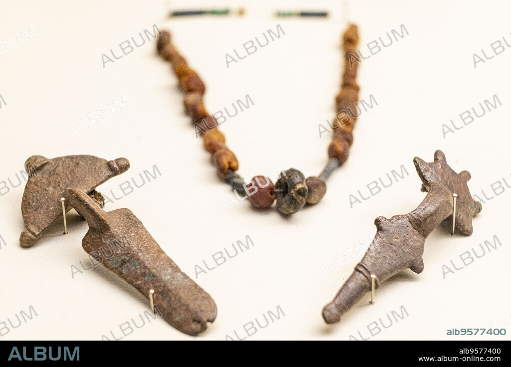 Fibula of arch and necklace of vitrea pasta and ambar beads, Museum of the Councils and the Visigoth Culture, Church of San Román,Toledo, Castilla-La Mancha, Spain.
