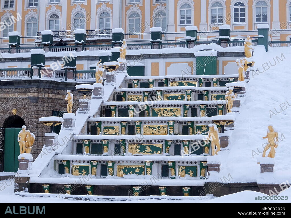 Peterhof Palace, a series of palaces and gardens located in Petergof, Saint Petersburg, Russia. Commissioned by Peter the Great as a direct response to his visit to the Palace of Versailles. In the period between 1714 and 1728, the architecture was designed by Domenico Trezzini, and the style he employed became the foundation for the Petrine Baroque style.