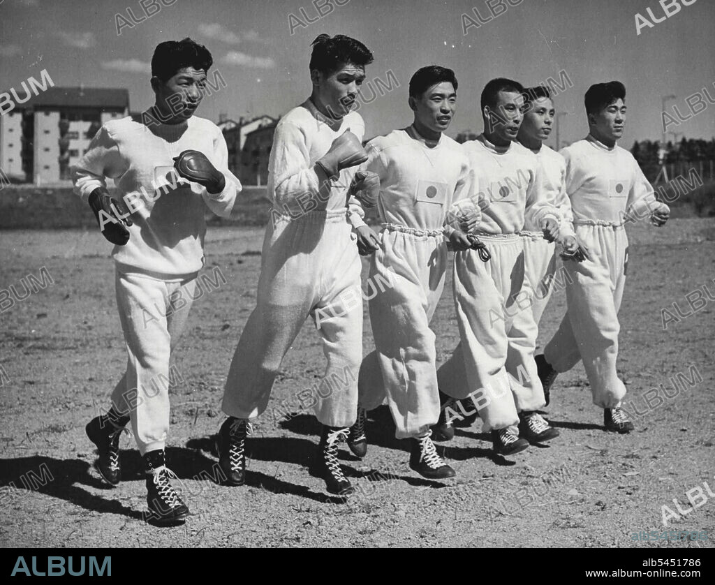 Japanese Fighting Men in Helsinki - Wrestlers and Boxers of the Japanese Olympic team set out on a training run together at the Olympic Village training ground, Helsinki, Finland, a few days ago.Left to right: Yoshitaro Nagato and Tohsihito Ishimaru (Boxers) and Yushu Kitano, Shohachi Ishii, Risaburo Tominga and Takeo Shimotori (Wrestlers). July 04, 1952. (Photo by Associated Press Photo).