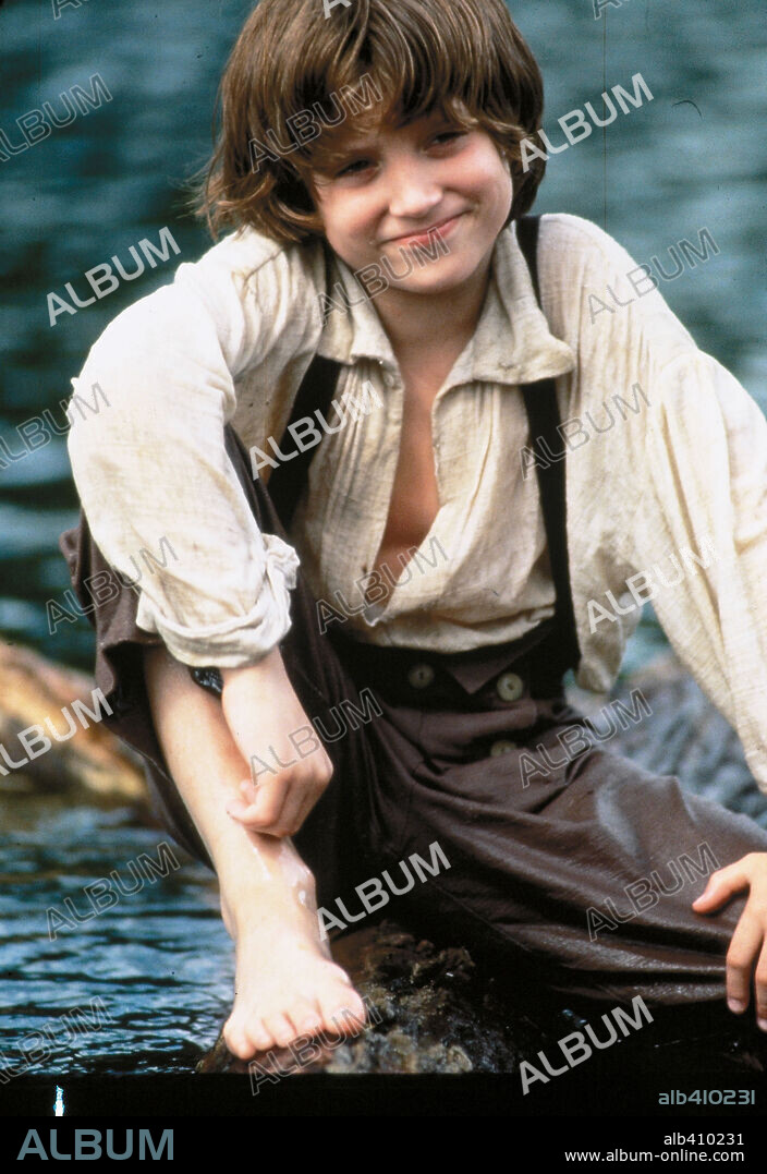 ELIJAH WOOD in THE ADVENTURES OF HUCK FINN, 1993, directed by STEPHEN SOMMERS. Copyright WALT DISNEY PICTURES.