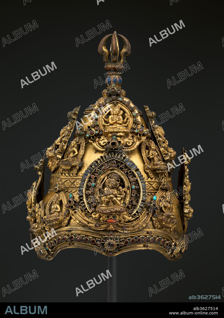 Vajracharya Priest's Crown. Culture: Nepal. Dimensions: H. 12 in. (30.5 cm); W. 9 in. (22.9 cm); D. 8 1/4 in. (21 cm). Date: 13th-early 14th century.
Elaborate crowns such as this were worn by Vajracarya priests, the highest rank in the Nepalese Buddhist community. The conical crown is unique to Newari Buddhism and embodies a memory of older and now lost Indian Buddhist practices. The term Vajracarya denotes both a caste and a family name, and the designation entitles its holders to perform reserved priestly functions, analogous to the privileges held by Brahmans in Hinduism. This crown is exceptional in its complexity: It is dominated by a series of diadem plaques depicting emanations of the wisdom bodhisattva Manjushri, benign and wrathful. All is surmounted by a five-pronged thunderbolt scepter, or vajra. This unique iconography points to the crown being designed for enacting rites dedicated to invoking Manjushri.