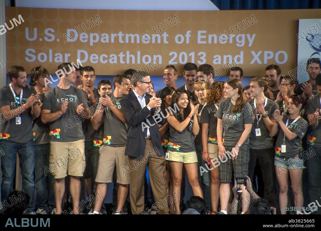 Happy winners of the Solar Decathlon from Ontario, Canada, are cheered in Irvine, CA. This worldwide competition to design energy efficient homes using solar power is sponsored by the US Department of Energy.