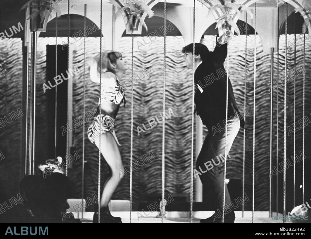 Go-go dancers in Miami Beach, mid-1960s. Go-go dancers are dancers who are employed to entertain crowds at discotheques or other clubs where music is played. Go-go dancing originated in the early 1960s, by some accounts when women at the Peppermint Lounge in New York City began to get up on tables and dance the twist. It is also claimed that go-go dancing originated at, and was named for, the very popular L.A. rock club Whiskey A Go Go which opened in January of 1964. Many 1960s-era clubgoers wore miniskirts and knee-high, high-heeled boots, which eventually came to be called go-go boots. Night club promoters in the mid‑1960s then conceived the idea of hiring women dressed in these outfits to entertain patrons.
