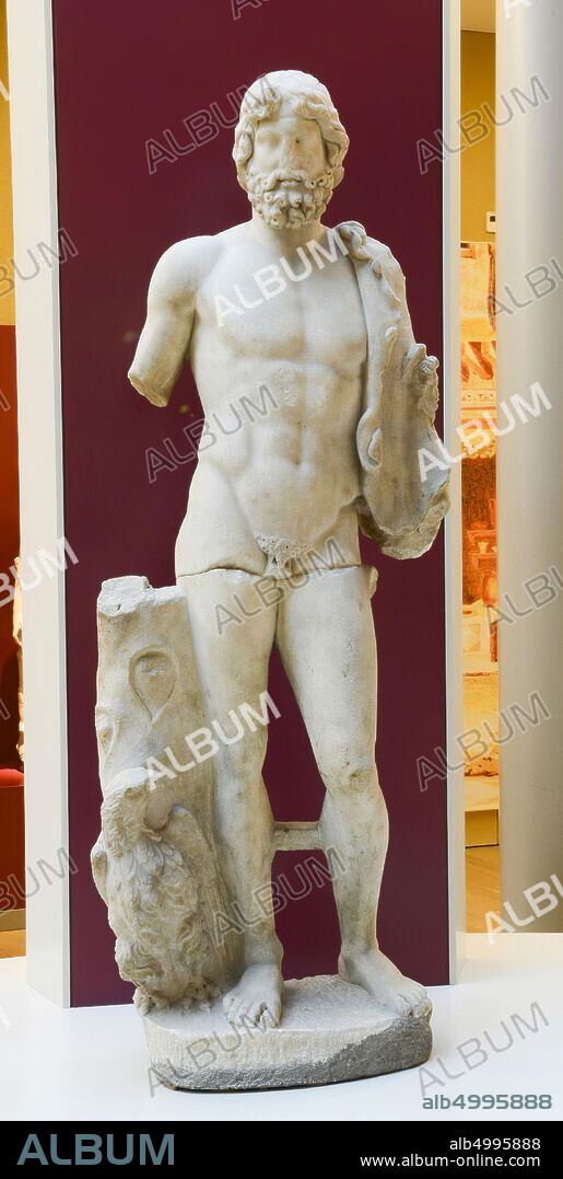 Standing image of naked man, by interpreting eagle next to him as Jupiter. The head features beard, mustache and long head hair., Sculpture, marble, 175 x 40 x 60 cm, 380 kg, imperial period 50-350 AD, Tunisia, Tunisia.