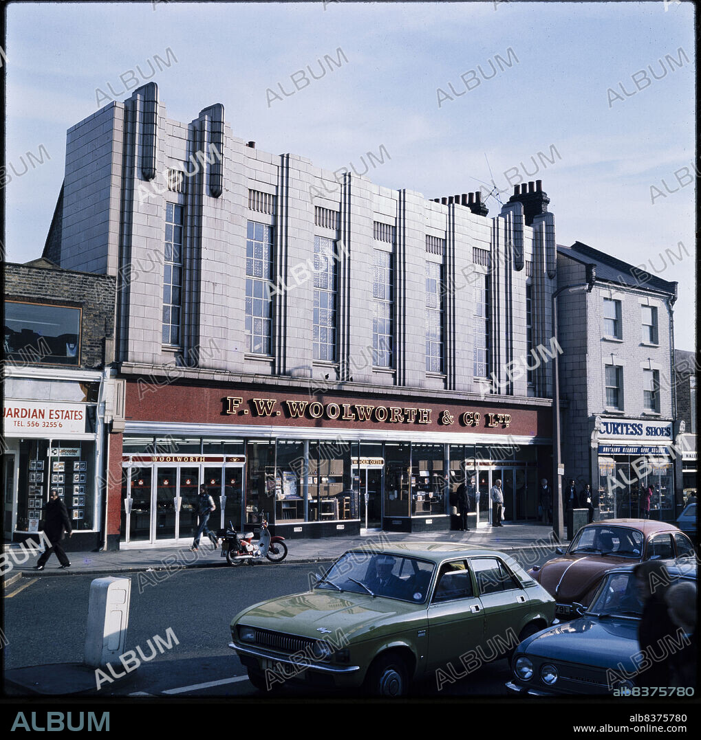 NICHOLAS ANTHONY JOHN PHILPOT. F W Woolworth and Company Limited, 612-614 Lea Bridge Road, Leyton, Waltham Forest, Greater London Authority, 1970s. The Lea Bridge Road elevation of the F W Woolworth and Co Ltd store at 612-614 Lea Bridge Road, seen from the north. The store on Lea Bridge Road was originally numbered store 129, and opened in 1923. It was renumbered as Woolworth's store 2024 in the 2000s. The building has two facades, the main elevation on Lea Bridge Road, shown in this photograph, and a smaller entrance on High Road to the north-east. The store closed in 2008 and the premises later became an Iceland store.