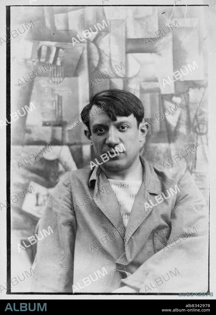 GEORGE DE ZAYAS. Pablo Picasso with his painting "The Aficionado" in the summer of 1912, in Sorgues.