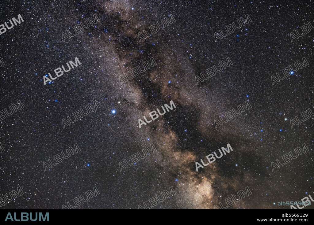 The constellation of Aquila (at centre) surrounded by Scutum and its starcloud (below) and Serpens and Ophiuchus (at right to the west). Altair is the bright star left of centre, with Tarazed above it. Albireo in Cygnus is at the very top. Above Aquila and below Albireo are the small constellations of Sagitta, Vulpecula and Delphinus (the latter at left). The Coathanger asterism is visible at top in the Milky Way, as are the large open clusters IC 4756 and NGC 6633, the S-O Double Cluster, at right straddling the Serpens-Ophiuchus border.