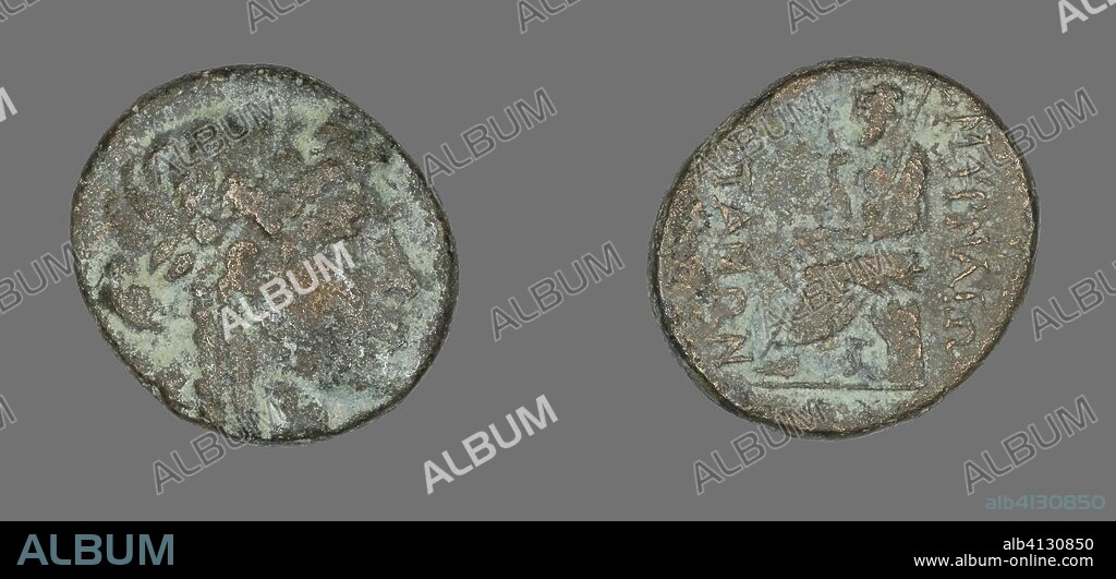 ANCIENT GREEK. Coin Depicting the God Apollo. Greek. Date: 200 BC-101 BC. Dimensions: Diam. 2.3 cm; 7.69 g. Bronze. Origin: Ancient Greece.