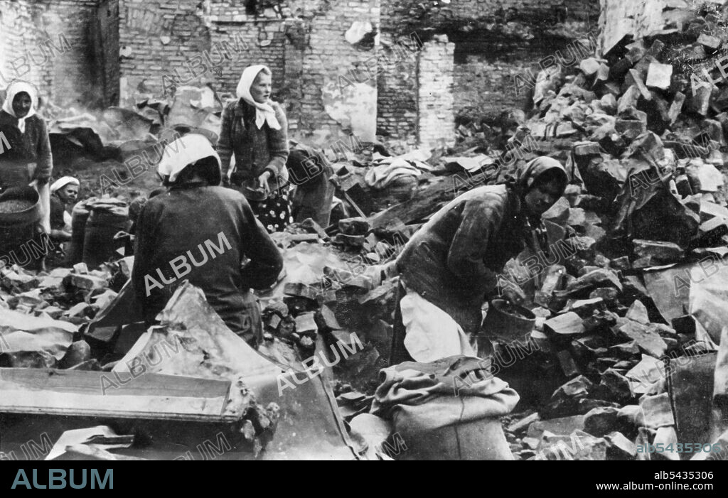 Searching For Their Belongings -- Russian peasant women searching amongst their wrecked houses for their belongings, after Nazis air raids. September 18, 1941. (Photo by Keystone Press Agency Ltd.).