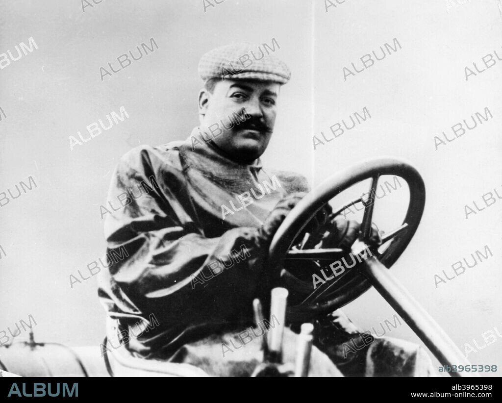 Vincenzo Lancia at the wheel of a car. The Son of an Italian soup manufacturer, Lancia began his career as Fiat's chief test driver. In 1904 he won the Coppa Florio motor race in Italy. He stopped competition driving in 1908 to build his own cars.