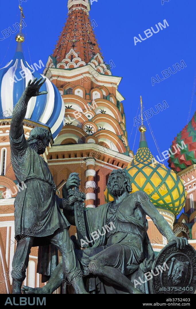 Minin and Pozharskiy statue and the St. Basil's Cathedral in Red Square illuminated in the evening, UNESCO World Heritage Site, Moscow, Russia, Europe.