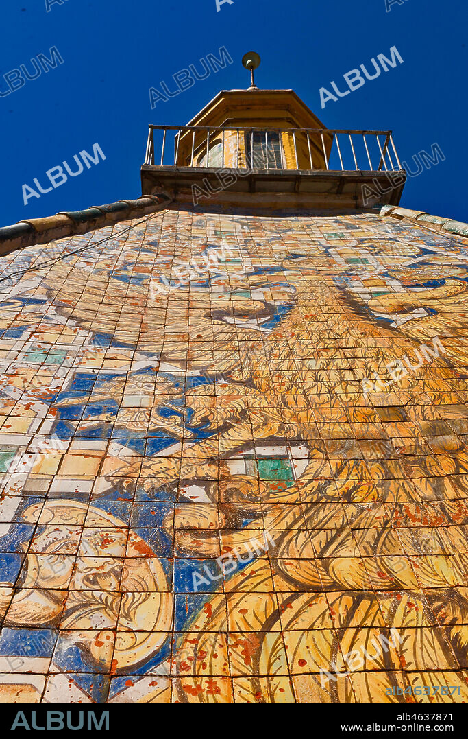 Palermo, The Royal Palace or Palazzo dei Normanni (Palace of the Normans), the Porta Nuova Tower: the pyramidal roof covered with polychrome majolica tiles with the image of an eagle with spread wings, designed by the architect Gaspare Guercio in 1663. Detail of the decoration with the eagle.