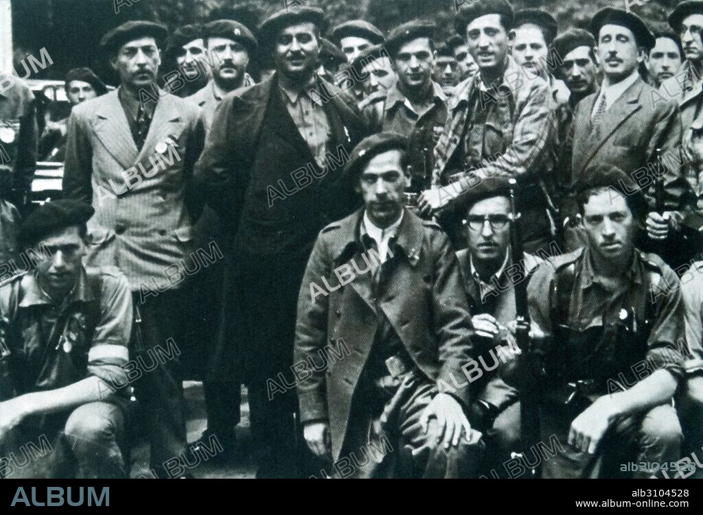Manuel Fal Conde the Carlist leader (dark coat 4th from left), leader of the Carlists with a militia group in Andalucía, Spain. Carlism is a political movement in Spain seeking the establishment of a separate line of the Bourbon dynasty on the Spanish throne. After the October 1934 Revolution, which cost the life of the Carlist deputy Marcelino Oreja Elósegui, Carlism started to prepare for an armed clash with the revolutionaries. During the Spanish Civil War (1936–1939) the Carlists were on the side of the Nationalist rebels.