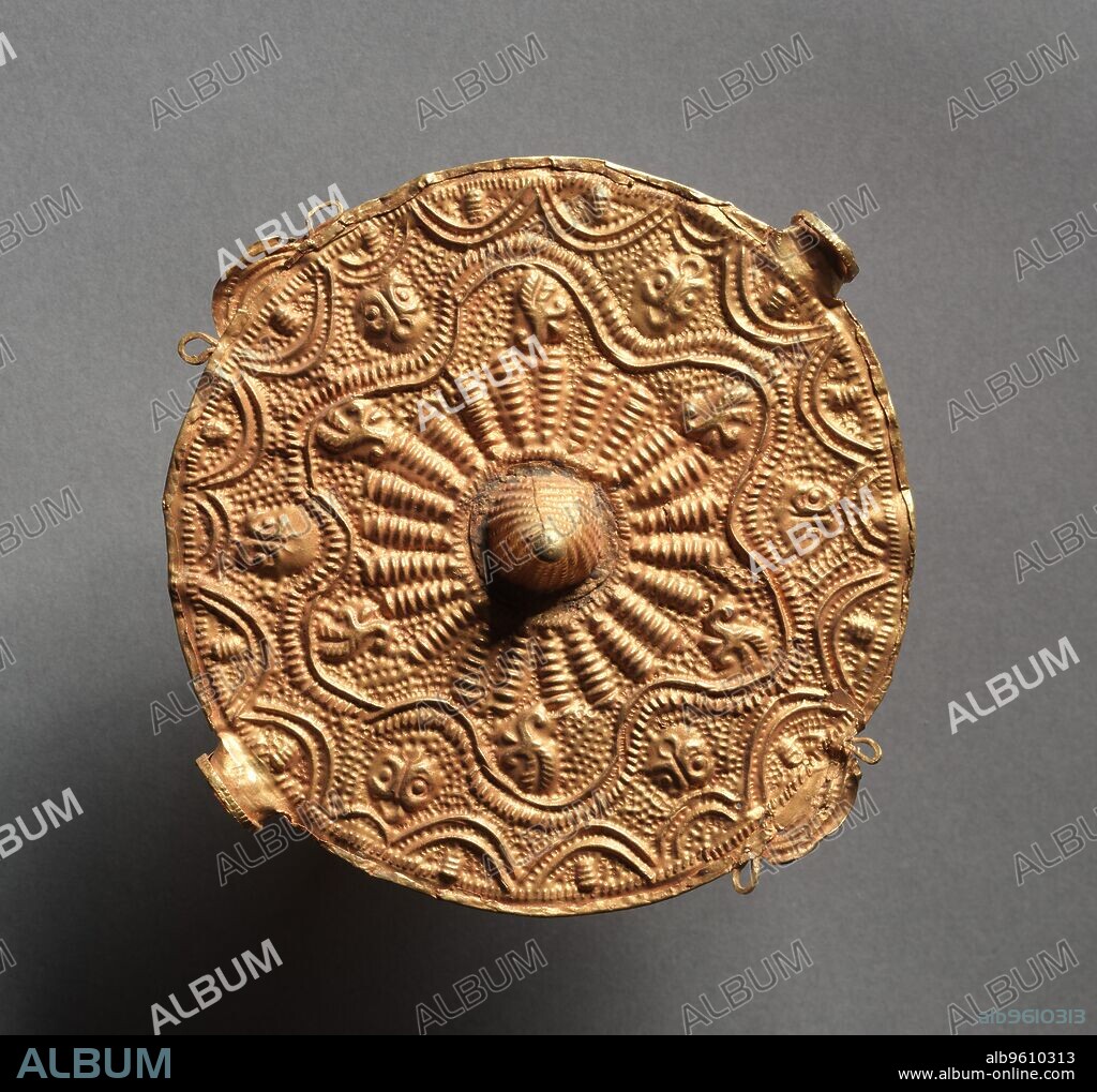 Soul Disk Pendant , 1800s. Shared by different Akan and Akan-related peoples, including the Asante and Baule, gold ornaments indicate status and wealth and are worn at public festivals by titleholders, chiefs, and kings. Most pectoral disks are suspended over the chest by a white, pineapple-fiber cord. They are owned by the okra, a young official who purifies the chief’s soul--hence, the name akrafokonmu, meaning "soul-washer’s badges" or "soul disks.".