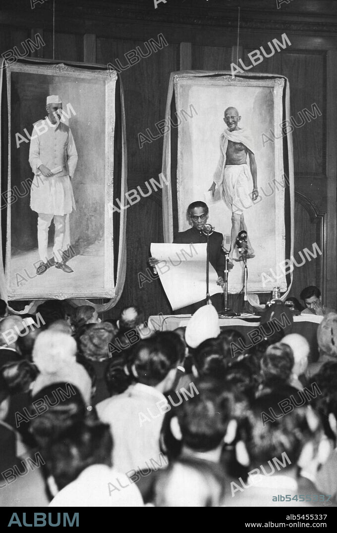 India Proclaims Independence - V.K. Krishna Menon, high commissioner representing India in London, seen at India House Jan. 26 as he reads the proclamation of Independence. January 26, 1950. (Photo by Associated Press Photo).