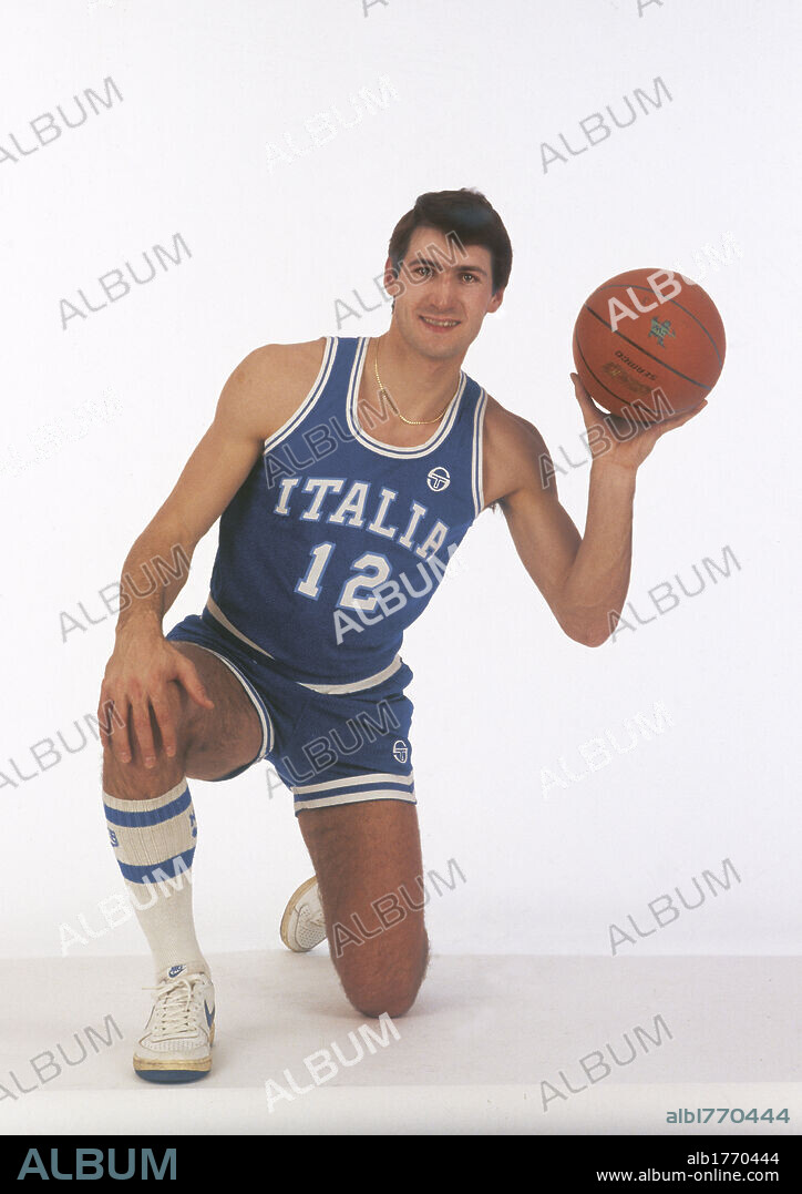 Antonello Riva with a basketball. The basketball player Antonello Riva wearing Italian national team uniform and holding a basketball in his hand. 1984.