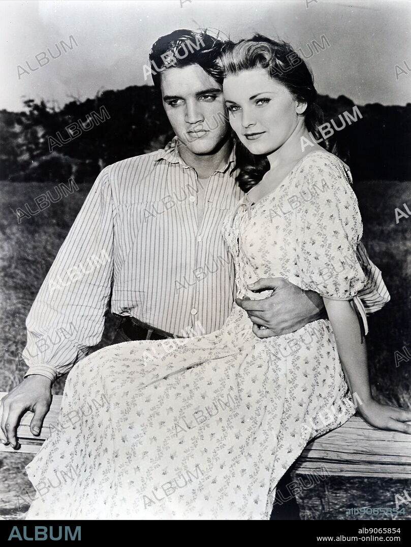 Photograph of Elvis and Priscilla Presley while on the set of 'Love me Tender'. Elvis Presley (1935-1977) an American singer, musician, and actor. Priscilla Presley (1945-) an American actress and business magnate. Dated 20th century.