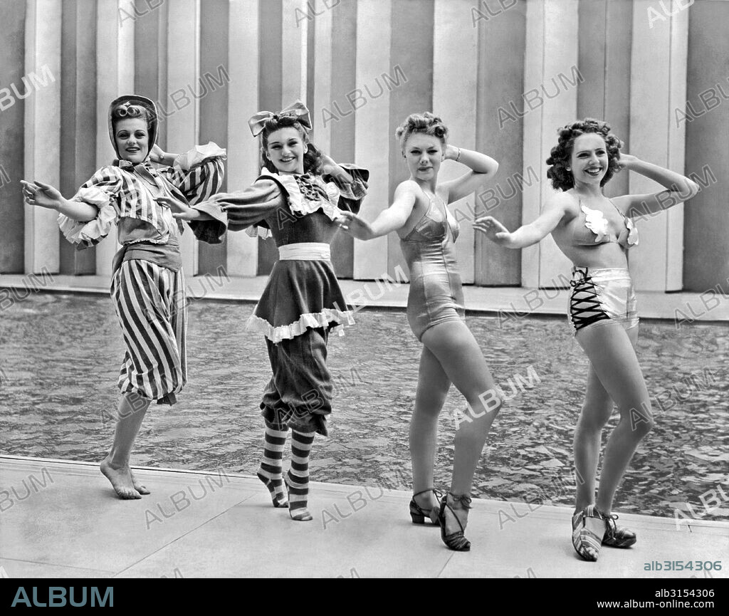 New York, New York:  July 4, 1939. Four of Billy Rose's 'Aquabelles' stage a fashion show of the past, present and future bathing suit styles at the New York World's Fair.