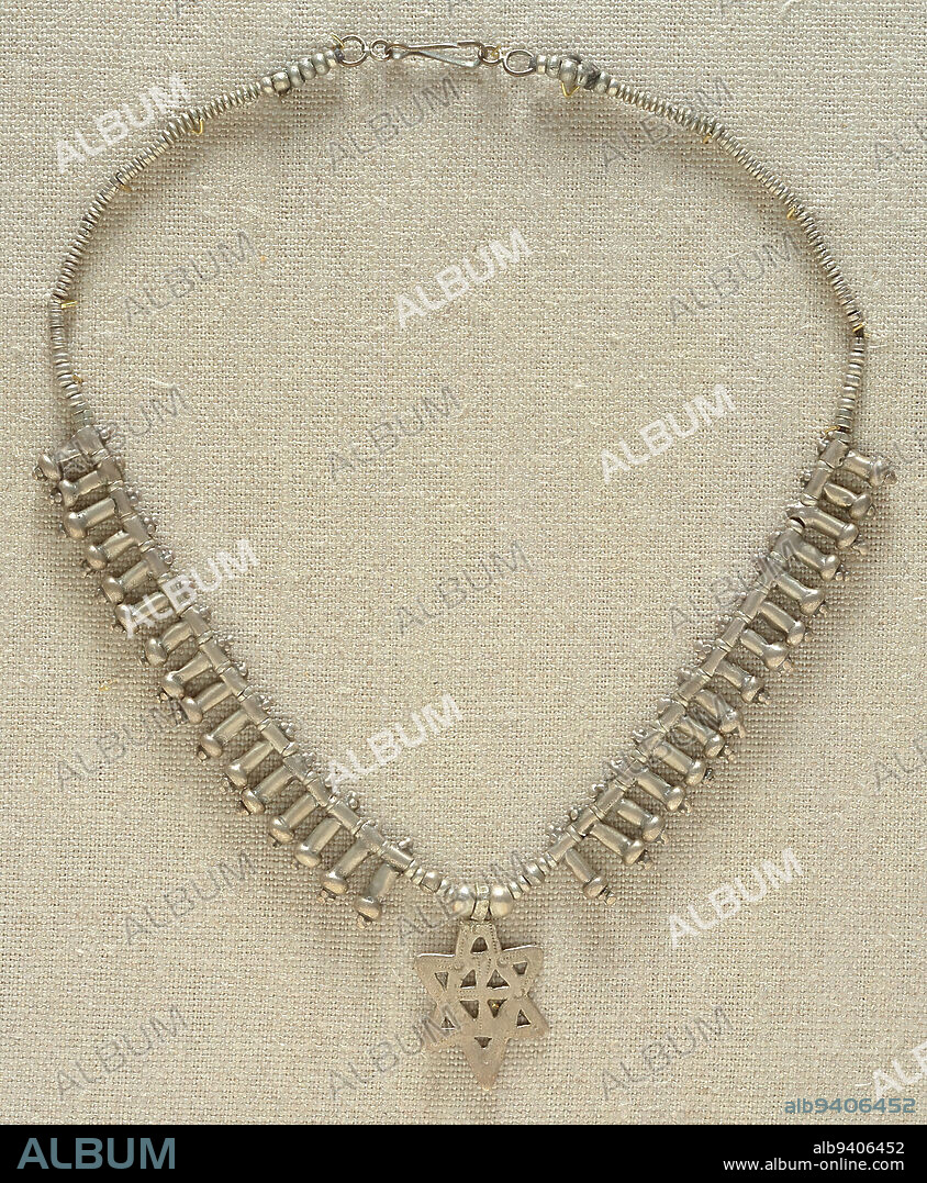 Necklace, 20th century, 17 1/8 x 1 1/2 in. (43.5 x 3.81 cm), Silver, metal, string, Ethiopia, 20th century, The Jewish Diaspora has a long history in Ethiopiaall the way back to King Solomon and the Queen of Sheba (950 BCE), according to some traditions. Ethiopians who practice Judaism call themselves Beta Israel, 'From the House of Israel.' This necklace features the Magen David (Star of David), one of the most universally recognized symbols of the Jewish faith. Many who wear the Star believe it offers good fortune and protection from evil spirits.