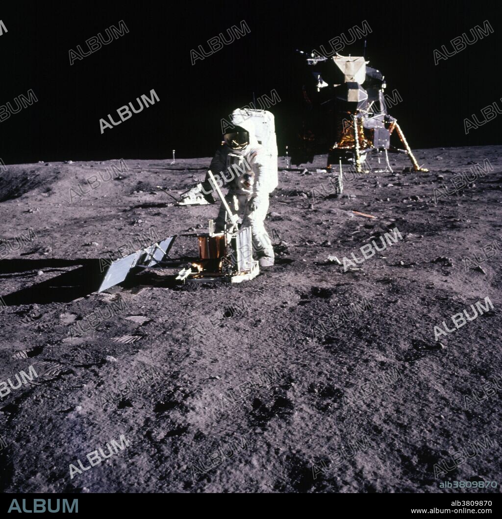Astronaut Edwin E. Aldrin Jr., lunar module pilot, walks on the surface of the moon during the Apollo 11 extravehicular activity (EVA) on July 20, 1969. In this image, he can be seen deploying the Passive Seismic Experiment Package (PSEP). While astronauts Armstrong and Aldrin descended in the Lunar Module (LM) "Eagle" to explore the Sea of Tranquility region of the moon, astronaut Michael Collins, command module pilot, remained with the Command and Service Modules (CSM) "Columbia" in lunar orbit.