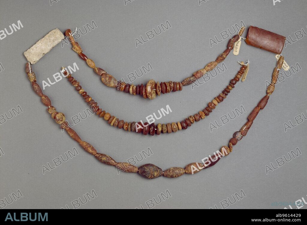 Beads, Early Iron Age, Hallstatt Period, c700-c450BC. Including: Magnificent amber necklace of 59 flattened circular beads, mostly discoidal, small bead at each end; String of 66 amber beads; 16 tubular or flattened tubular with groups of discoidal or globular beads in between-  50 beads; Dimensions: length: 25 cmdiameter: 1.5 cm (largest bead).