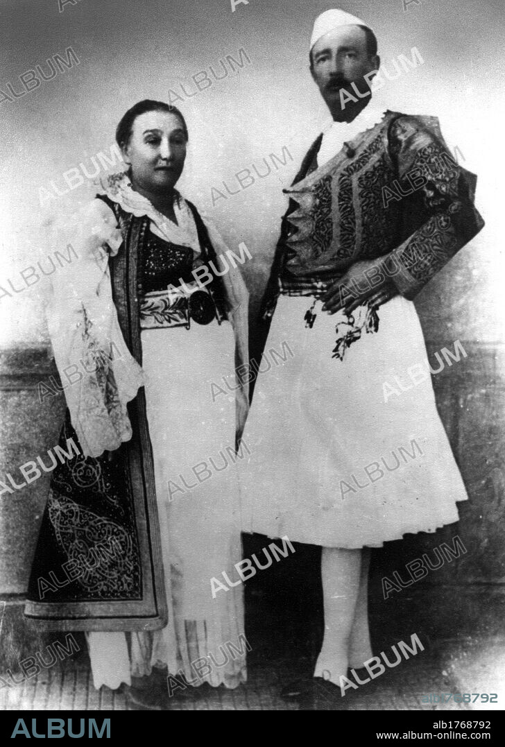 King Zog I of Albania with his mother. King Zog I of Albania and the mother Sadije Toptani wearing traditional Albanian dress. 1930.