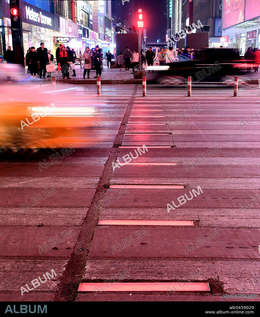 January 17, 2020, Shenyang, Shenyang, China: Liaoning,CHINA-People pass an intelligent zebra crossing at the intersection of Zhonghua road and Taiyuan street in Shenyang, Liaoning province, jan 15, 2020.The glowing crosswalk flashes red, yellow, or green as traffic lights change. (Credit Image: © SIPA Asia via ZUMA Wire).