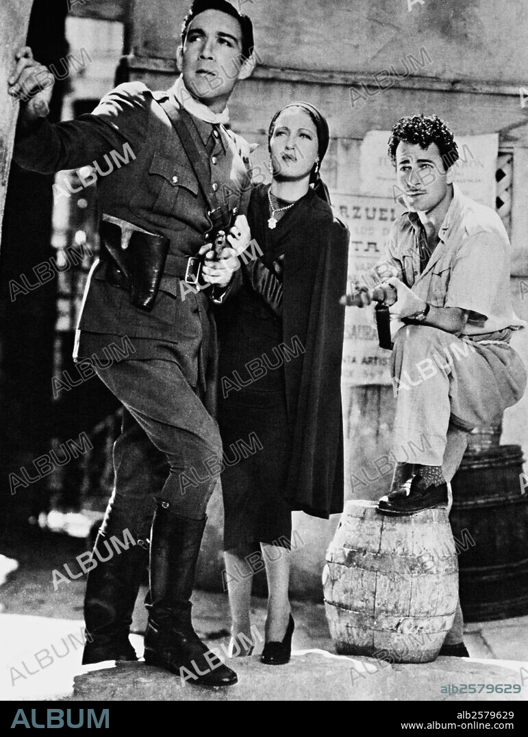 ANTHONY QUINN, DOROTHY LAMOUR and GILBERT ROLAND in THE LAST TRAIN FROM MADRID, 1937, directed by JAMES P. HOGAN. Copyright PARAMOUNT PICTURES.
