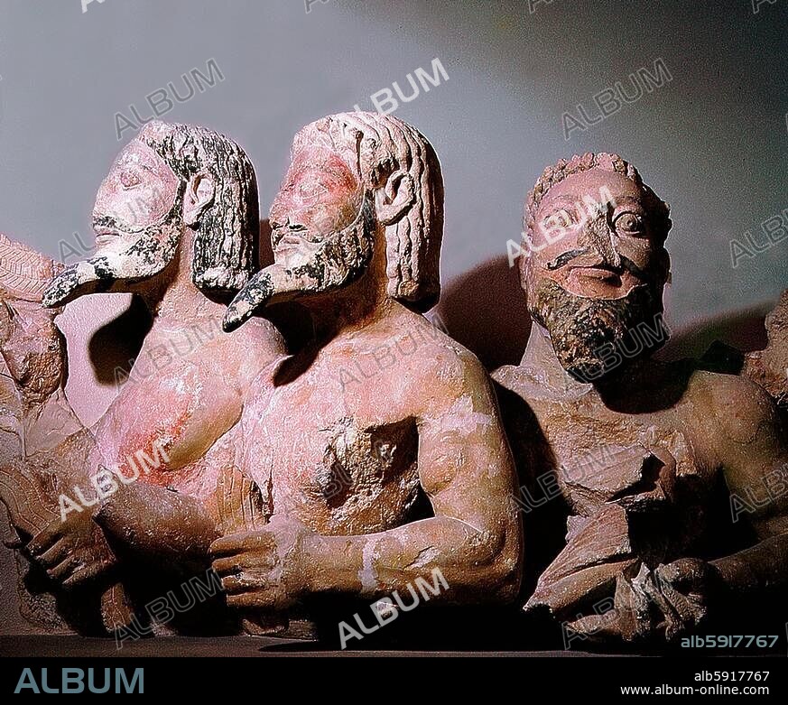 The multi-headed monster Typhon whose torso terminate in the body of a dragon. He holds birds, sparks of fire and stylised waves in his hands. Country of Origin: Greece. Culture: Ancient Greek. Date / Period: Period of Solon (circa 640-560 BC). Place of Origin: Hecatompedon. Material Size: Porous limestone & pigment.