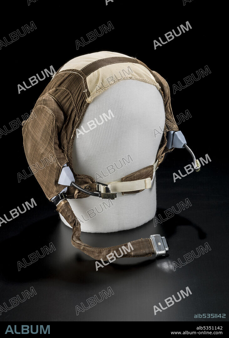 INC. PACIFIC PLANTRONICS. Communications carrier used by Neil Armstrong, Apollo 11, 1949. Headset used by astronaut Neil Armstrong during the Apollo 11 mission in July 1969. Communications carriers were worn during launch and the mission, and were affectionately known as the "Snoopy Cap" from its resemblance to a famous cartoon character of the era. It was constructed of an elastic center portion with Teflon fabric sides containing the communications equipment and mouthpiece. It fastened beneath the chin and was worn during the launch sequence, while in the lunar module, and on the lunar surface.