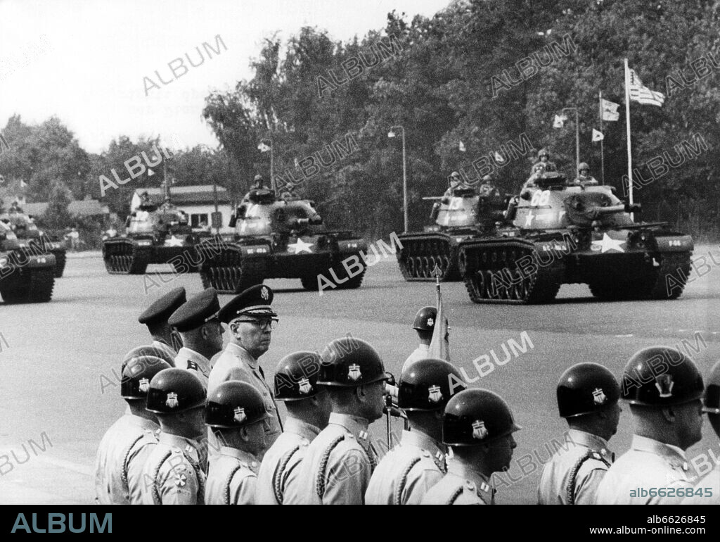 US General Bruce C. Clarke (m, with glasses), Supreme Commander of the American troops in Germany taking over a parade of the US troups on 3rd July 1961, the evening before the Independence Day. 03/07/1961