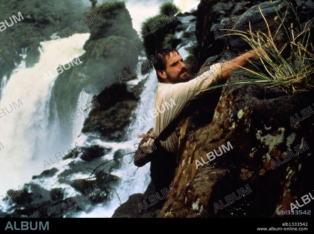 JEREMY IRONS in THE MISSION, 1986, directed by ROLAND JOFFE. Copyright WARNER BROTHERS.