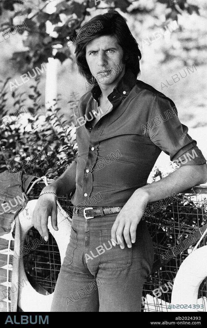 Sandro Giacobbe in a park. Italian singer-songwriter Sandro Giacobbe posing in a park. Milan, 1974.