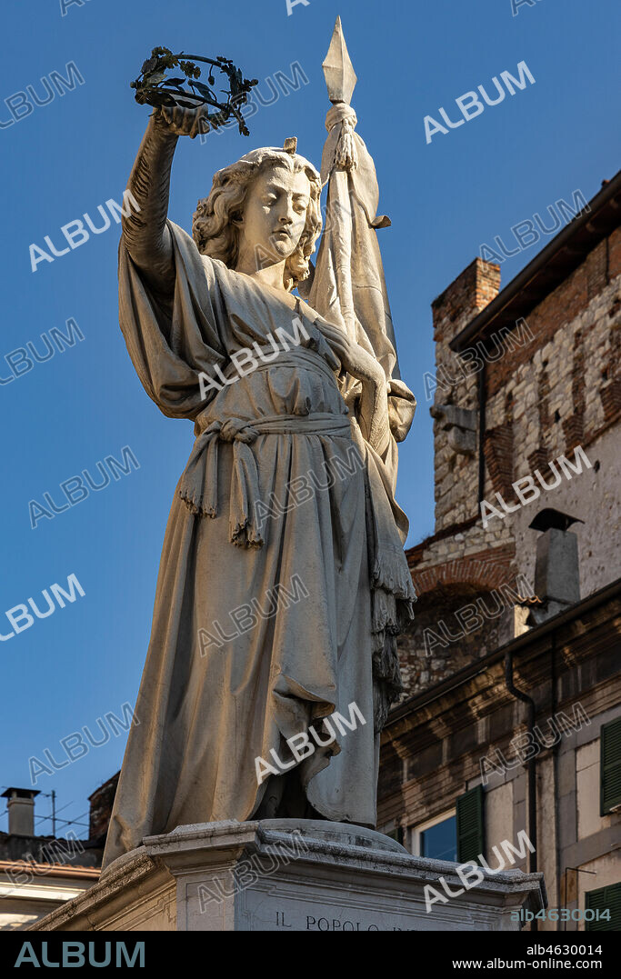 Brescia, piazza della Loggia (a Renaissance square where the Venetian influence is evident): the marble monument "Bella Italia or Bell'Italia" by Giovanni Battista, 1864. Dedicated to the fallen of the Ten Days of Brescia, it was given to the city by Vittorio Emanuele II.