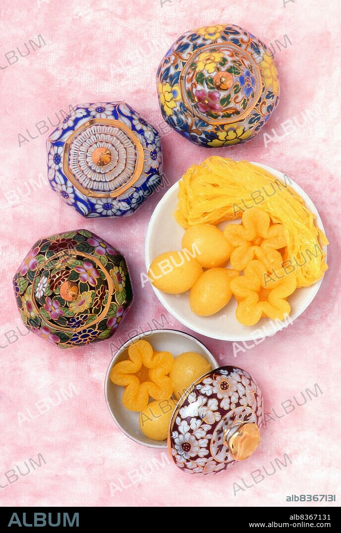 <i>Thong Yip</i> (pinched egg yolks), <i>Thong Yot</i> (gold egg yolk drops) and <i>Foi Thong</i> (gold egg threads), are three of the nine auspicious traditional Thai desserts. They are usually made for important occasions and ceremonies such as weddings, ordinations and housewarmings. They were introduced to Siam (Thailand) by Japanese-Portuguese Maria Guyomar de Pinha also known as Thao Thong Kip Ma (1664 - 1728) in the reign of Somdet Phra Narai Maharat during the Ayutthaya Kingdom and are of Portuguese origin.<br/><br/>. Benjarong ware is a kind of painted Thai ceramic porcelain. The name literally means 'five colors'. The painted decoration usually consists of 3 to 8 colours. For the decoration, repetitive forms, usually geometric or flower-based, are used.