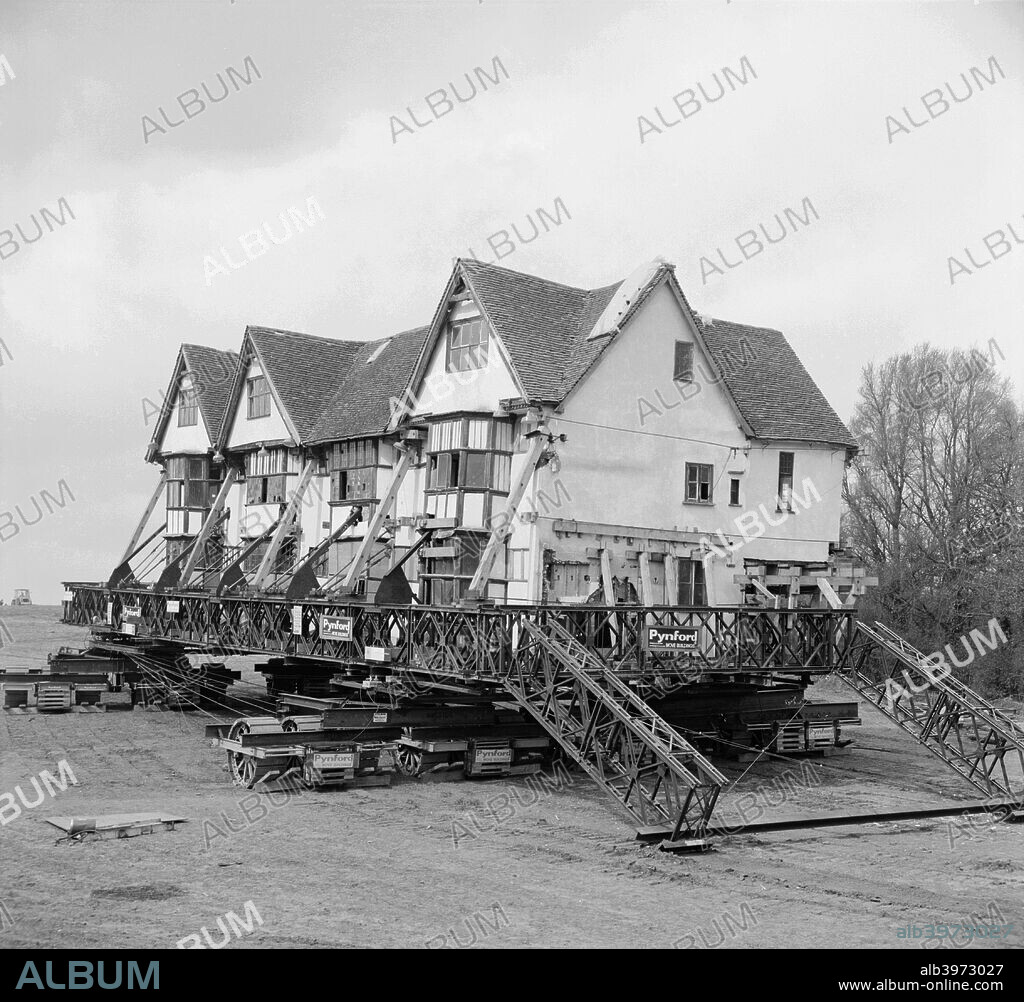 Ballingdon Hall being moved, Suffolk, 1972. Ballingdon Hall, Sudbury, Suffolk, was moved 200 yards when the A131 was improved. The entire house was strengthened and placed on a huge vehicle. The timber-framed house was built in about 1593 by Sir Thomas Eden.
