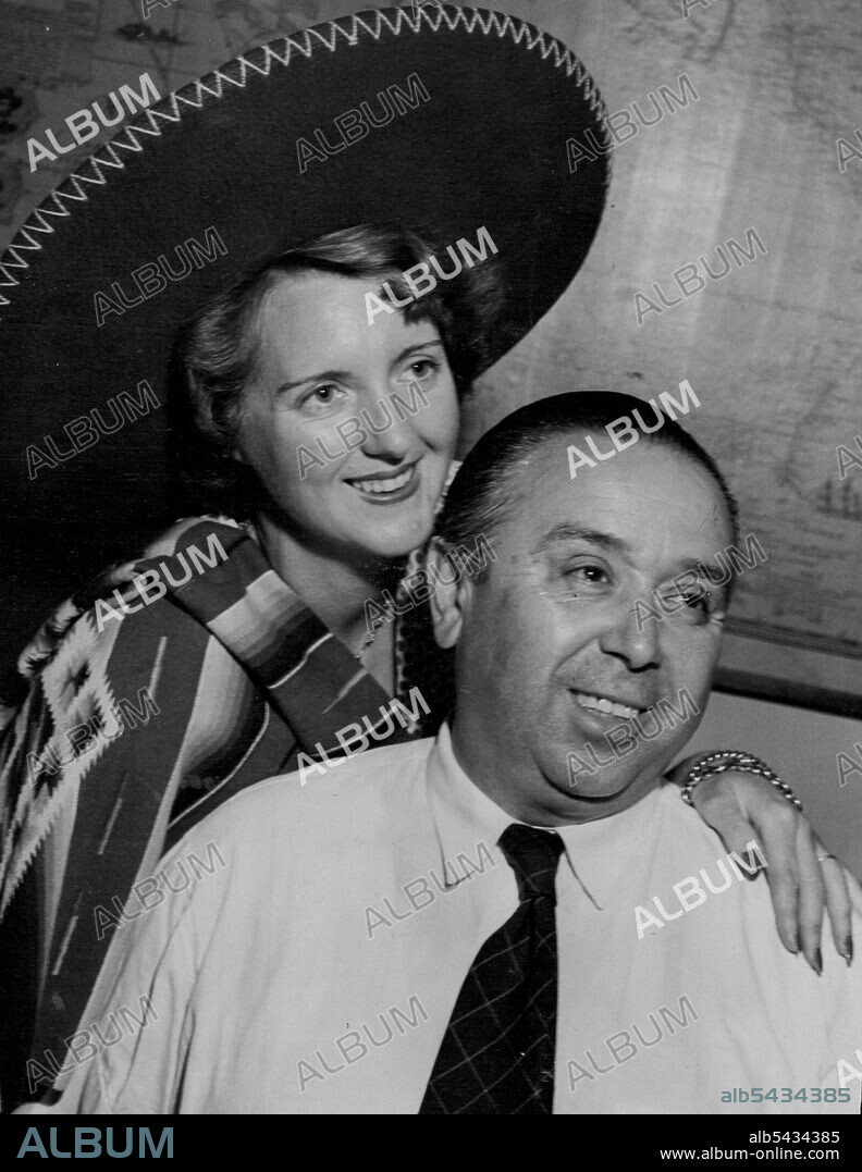 In Mexican blanket and sombrero, Mrs. Zalapa and Carlos in one of their two Sydney homes. May 10, 1950.