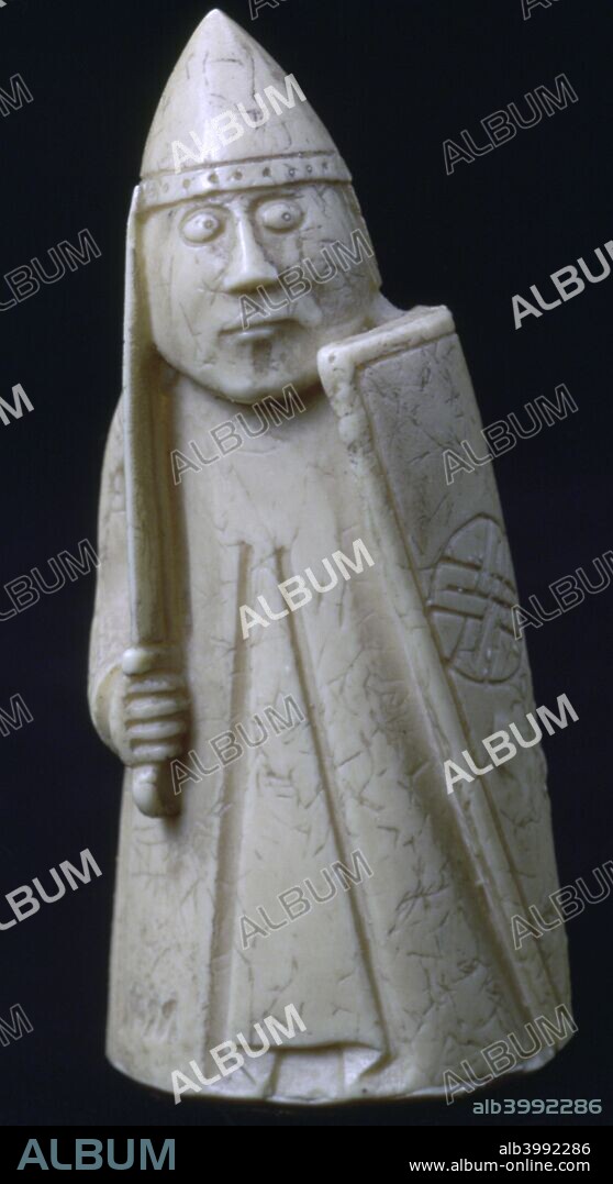 The Lewis Chessmen, (Norwegian?), c1150-c1200. A Knight / Rook piece from a collection of ninety-three found at Uig on the Isle of Lewis, Outer Hebrides, Scotland. Taking the form of seated kings and queens, mitred bishops, knights on their mounts, standing warders and pawns in the shape of obelisks, most of them are made from Walrus ivory, and a few from whale teeth. From the British Museum's collection.