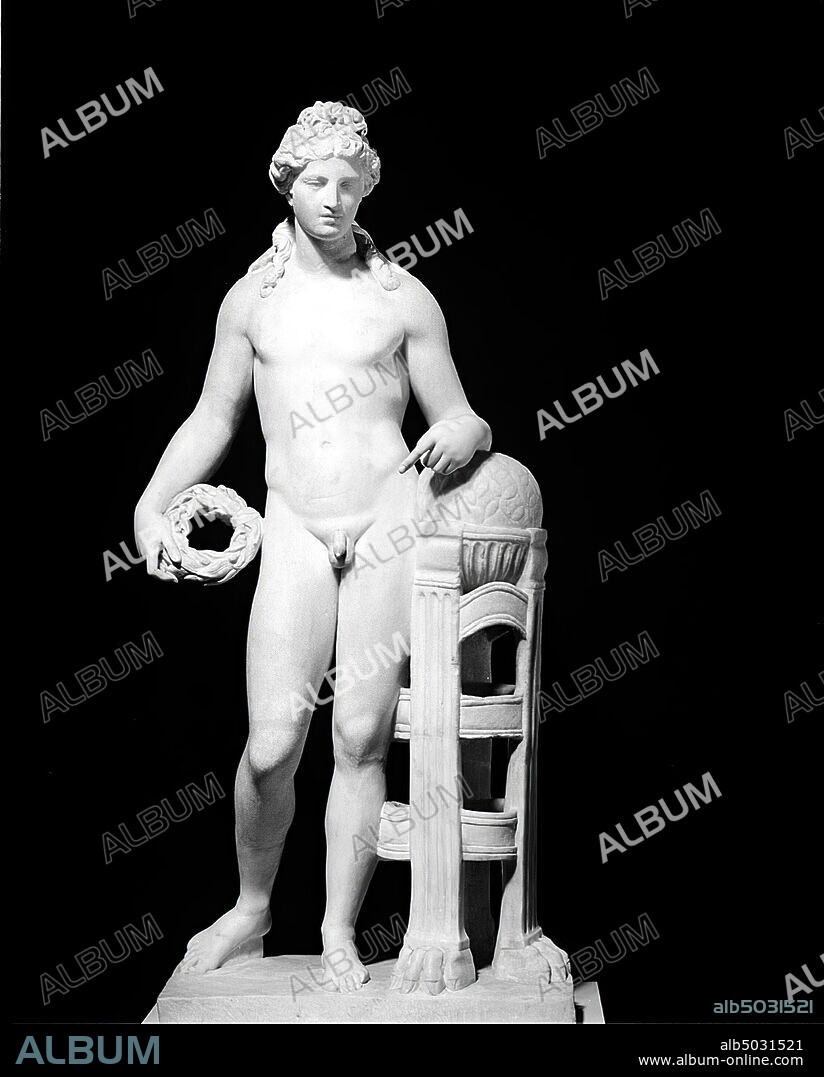 Standing statue of Apollo with omphalos. The god is completely naked. A wreath in the right hand. The left forearm is supported on the omphalos, which is supported by a tripod with lion's feet., Sculpture, stone, marble, 112 cm, 150 kg, imperial age 50-350 AD, unknown.