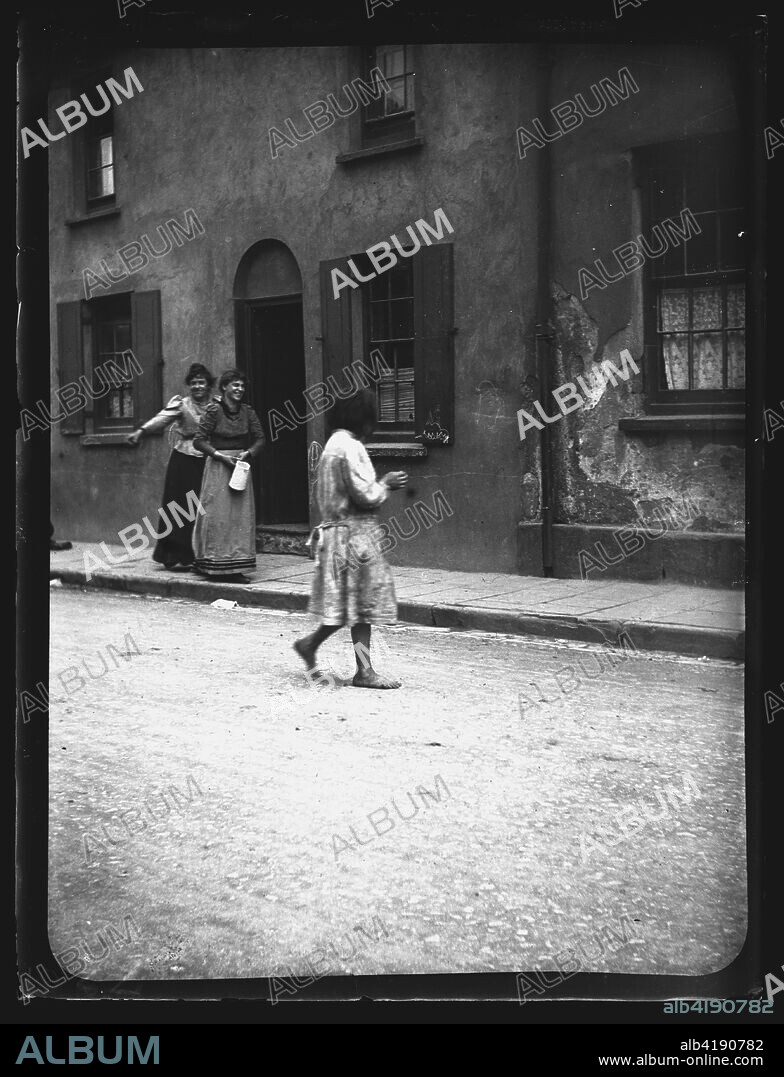 Mary Ann Street, Cardiff, 1893. A child playing barefoot in Mary Ann Street, Cardiff, 1893.
