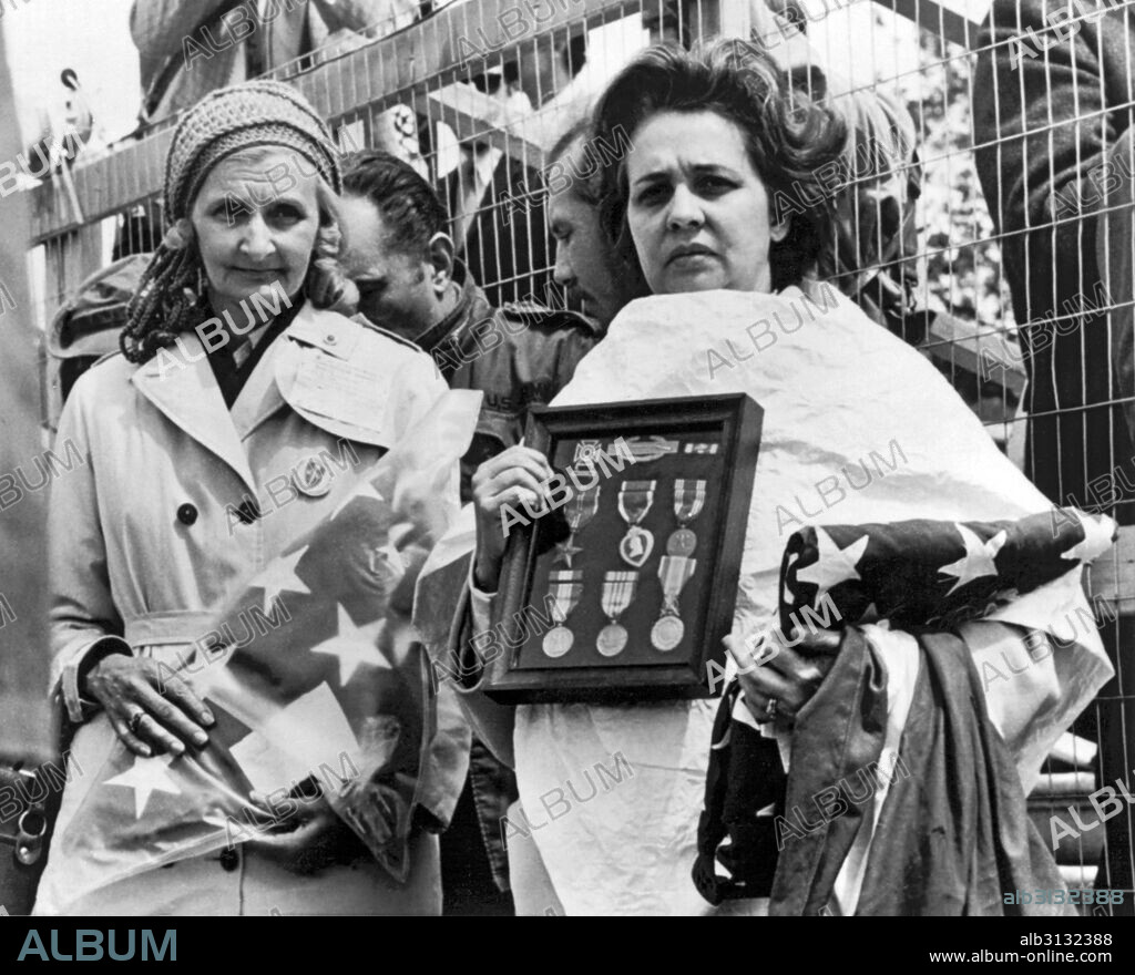 Washington, D.C.:  April 23, 1971 Two Gold Star mothers hold their dead sons' medals and flags at an anti Vietnam war protest near the Capitol today. They are Anna Pine (L) of Trenton, New Jersey and Evelyn Carrasquillo of Miami, Florida. Fred Pine and Alberto Carrasquillo were killed in Vietnam in 1968.
